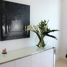 Green Heliconias and Calla Lilies in Moon Vase