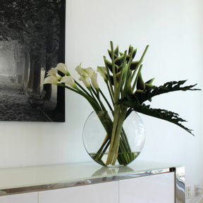 Green Heliconias and Calla Lilies in Moon Vase